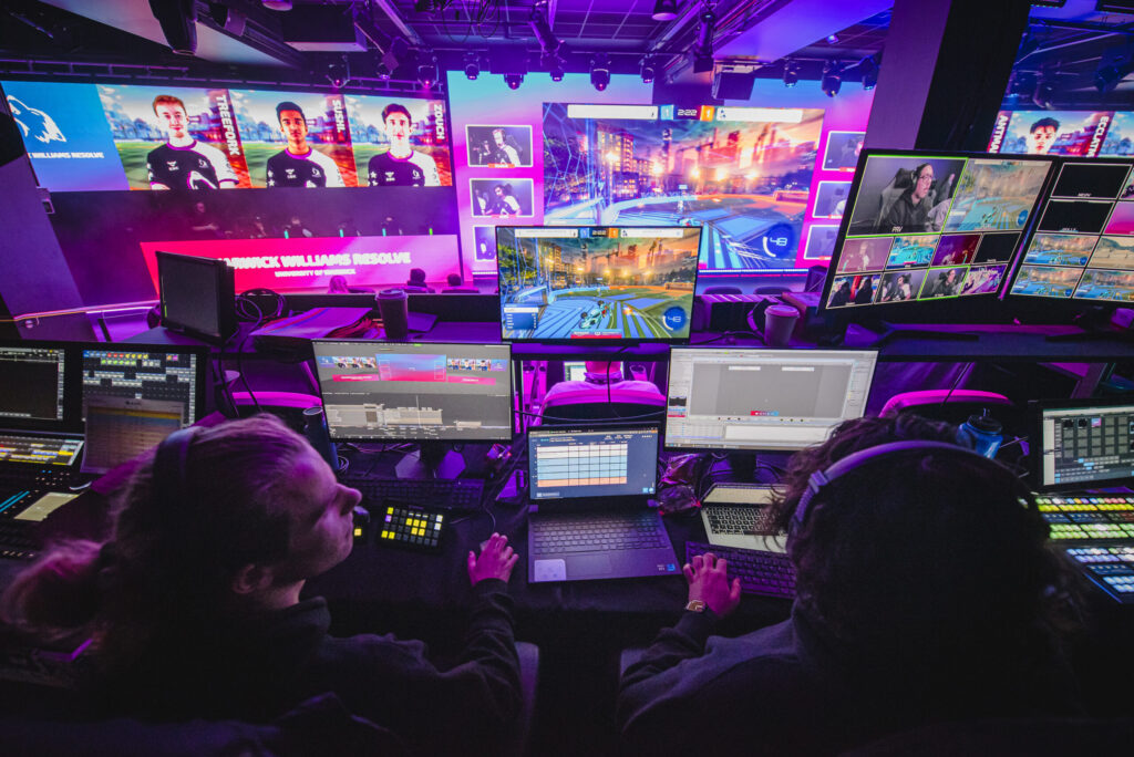 Students broadcasting and controlling the set-up at a live Esports event