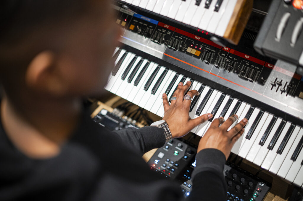 Student using synth equipment