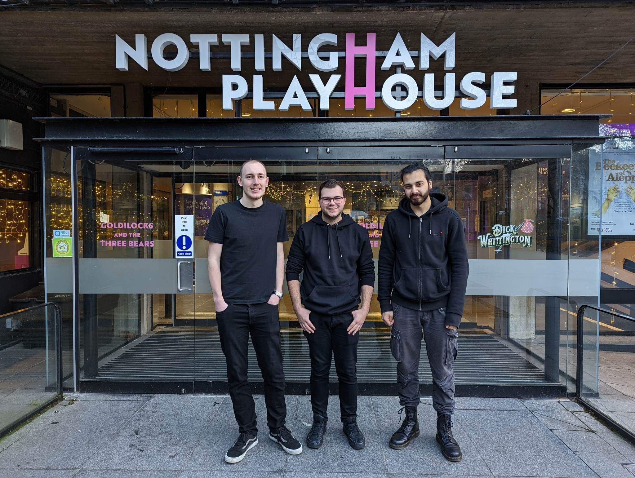 Pictured are Confetti work experience students, Jack, Ryan and Gurinder, standing outside the Nottingham Playhouse signage - where they completed their placement.