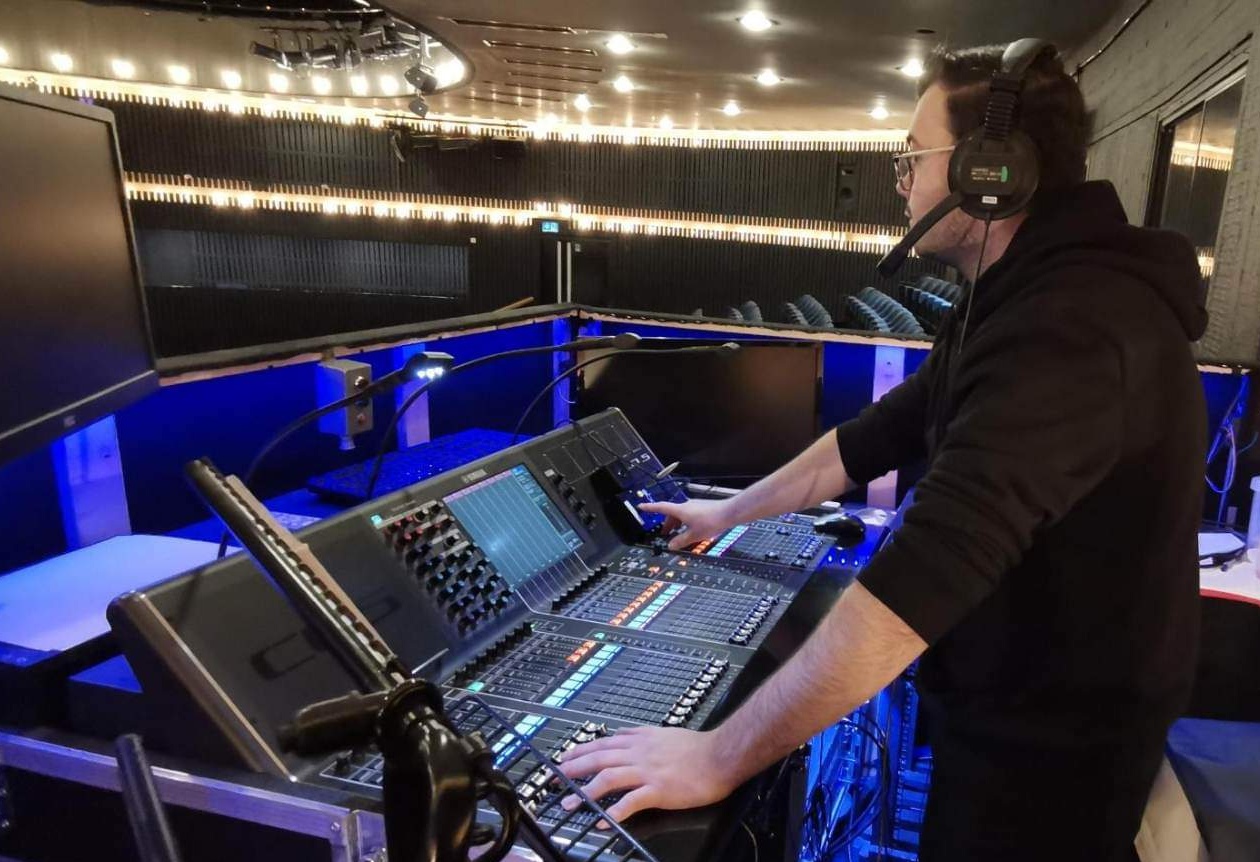 Pictured is Ryan Raistock operating sound and lighting controls at Nottingham Playhouse