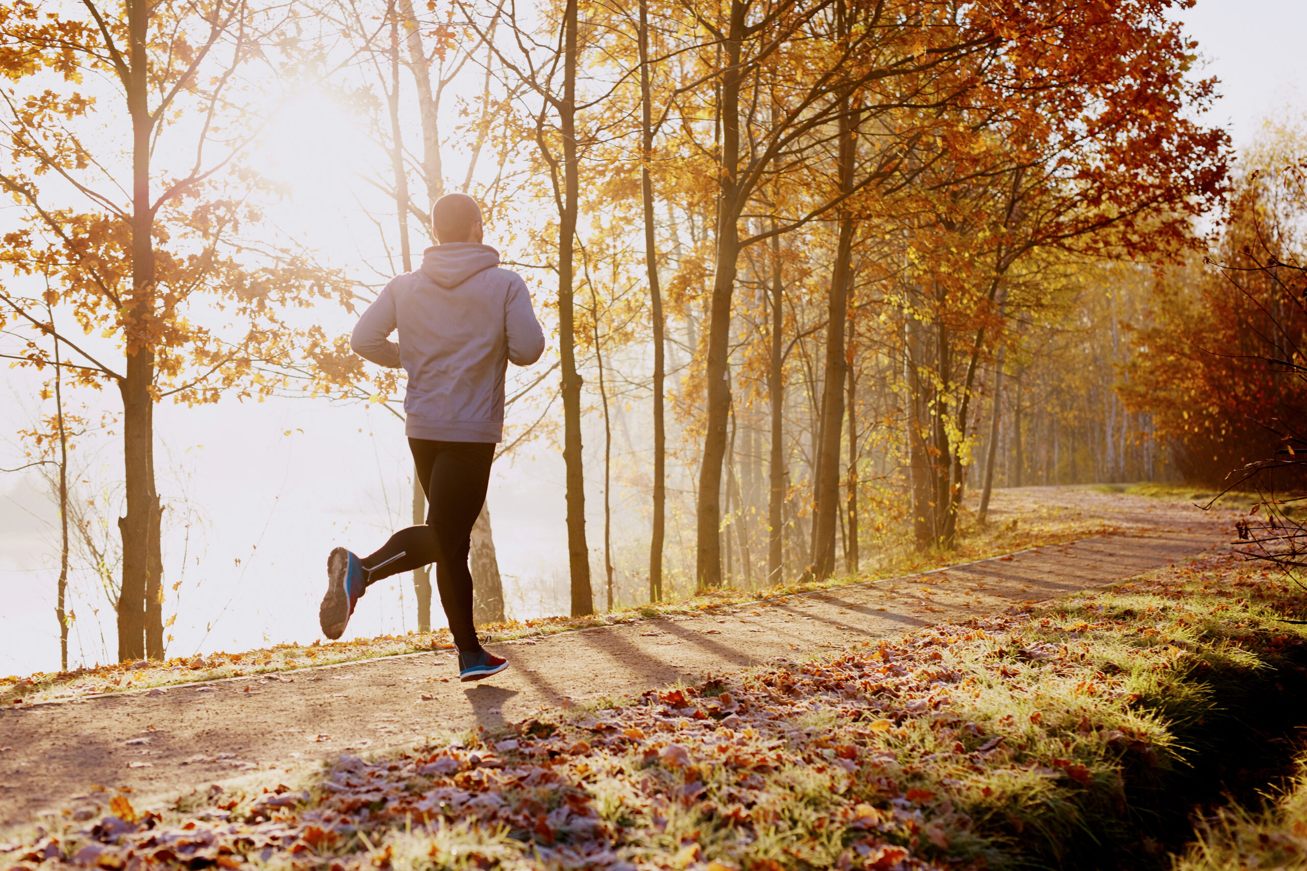 Man running in a park in Autumn