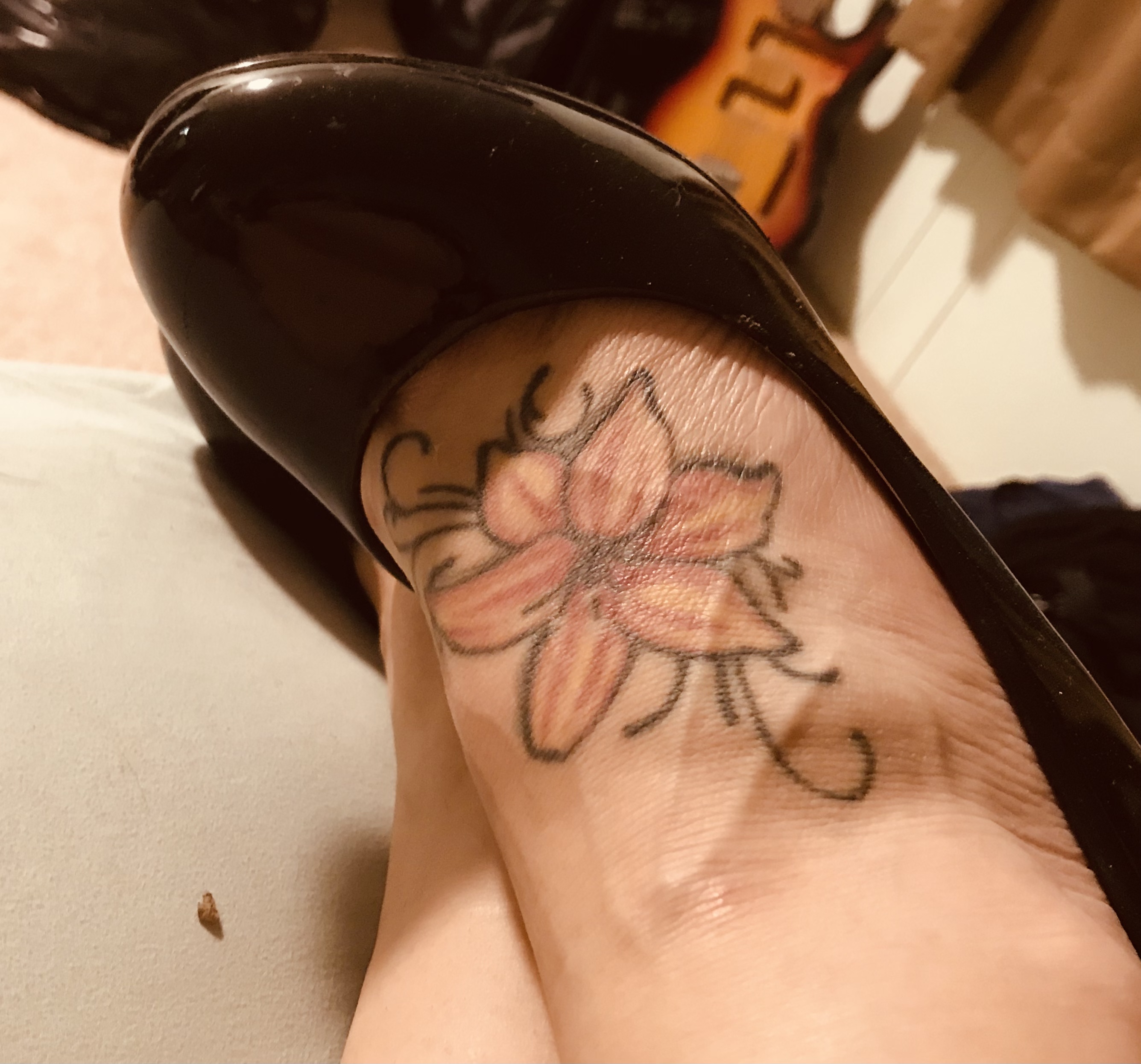 Black heels and lily tattoo