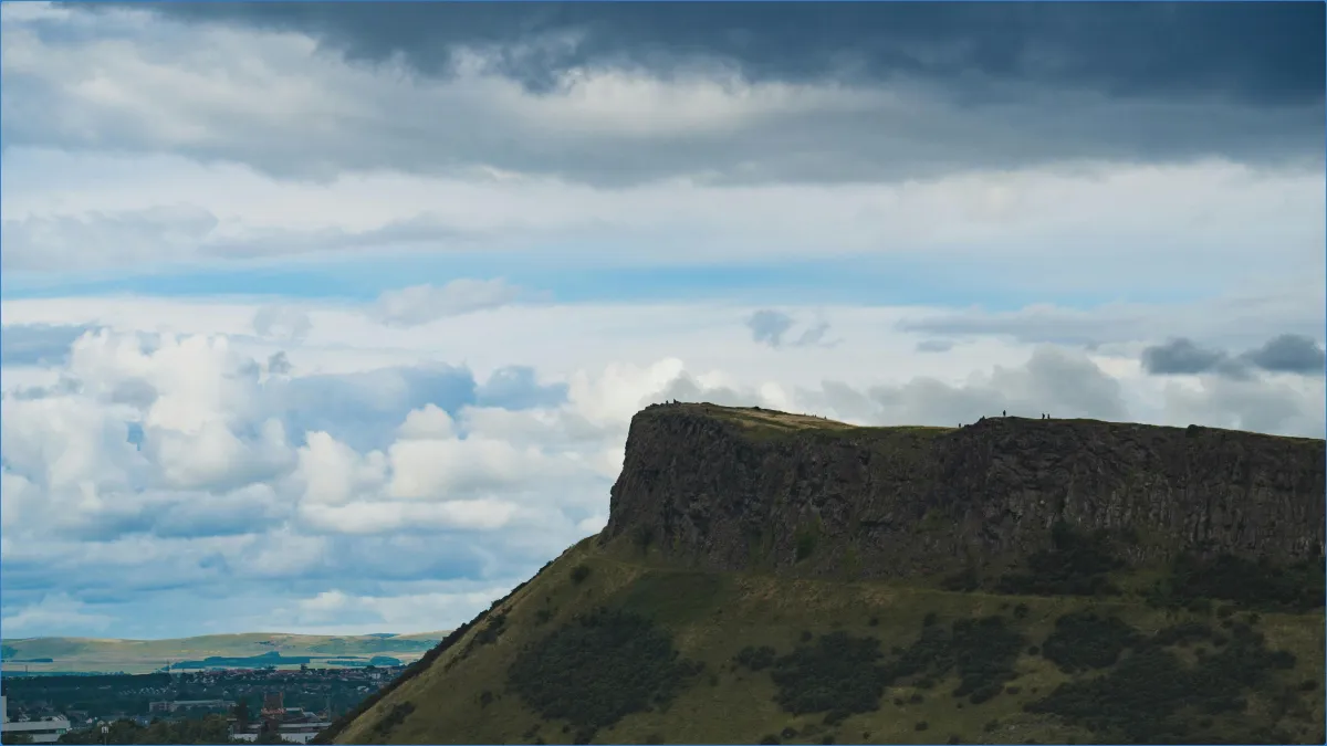 Cliff with cloudy sky background