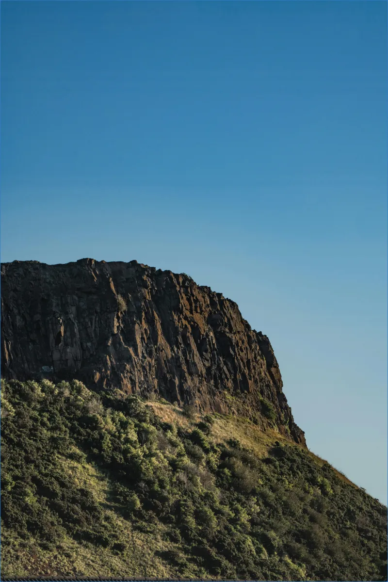 Rocky hill under clear blue sky