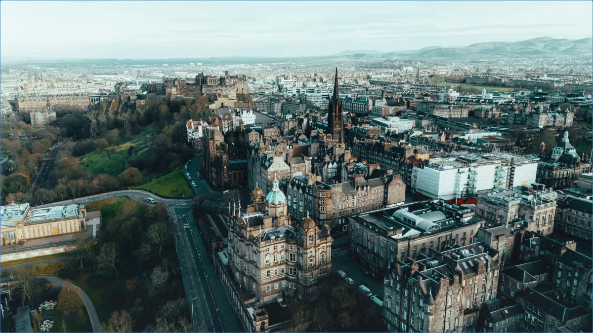 Aerial view of Edinburgh cityscape with historic buildings.