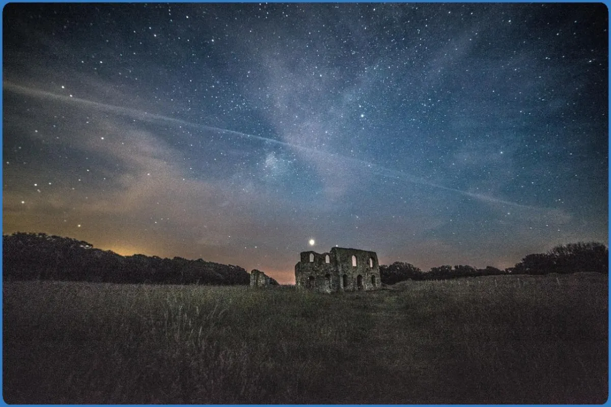 Ruins under a starry night sky