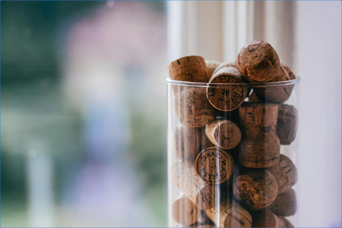 Glass container filled with wine corks