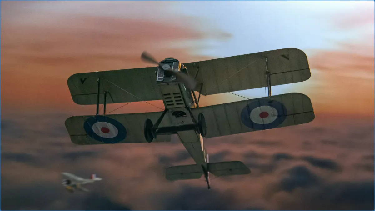 Vintage biplane flying over clouds at sunset.