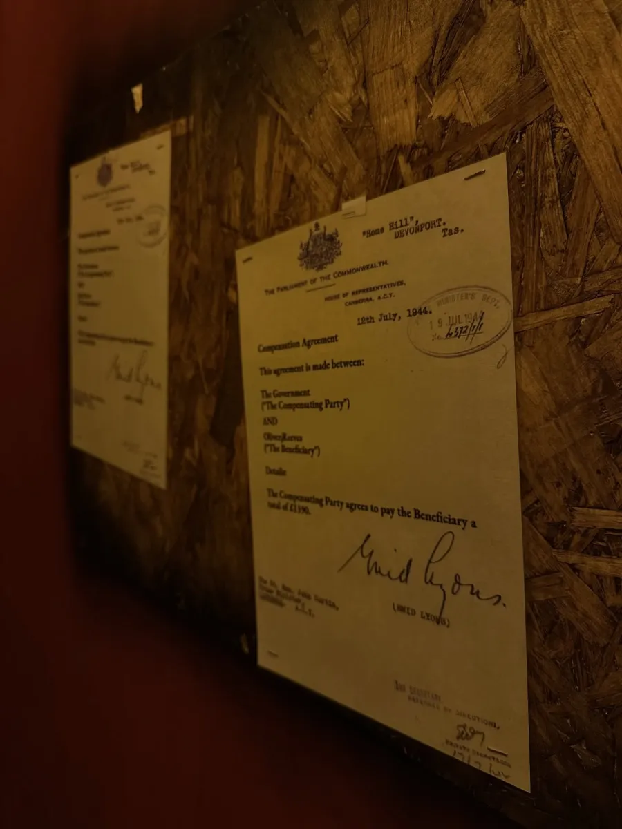 Framed historical document on a wall.