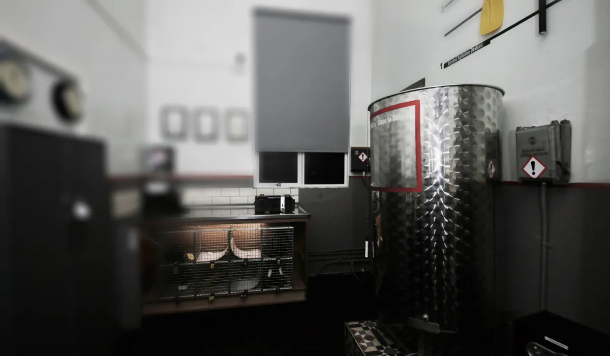 Industrial room with metal tank and equipment.