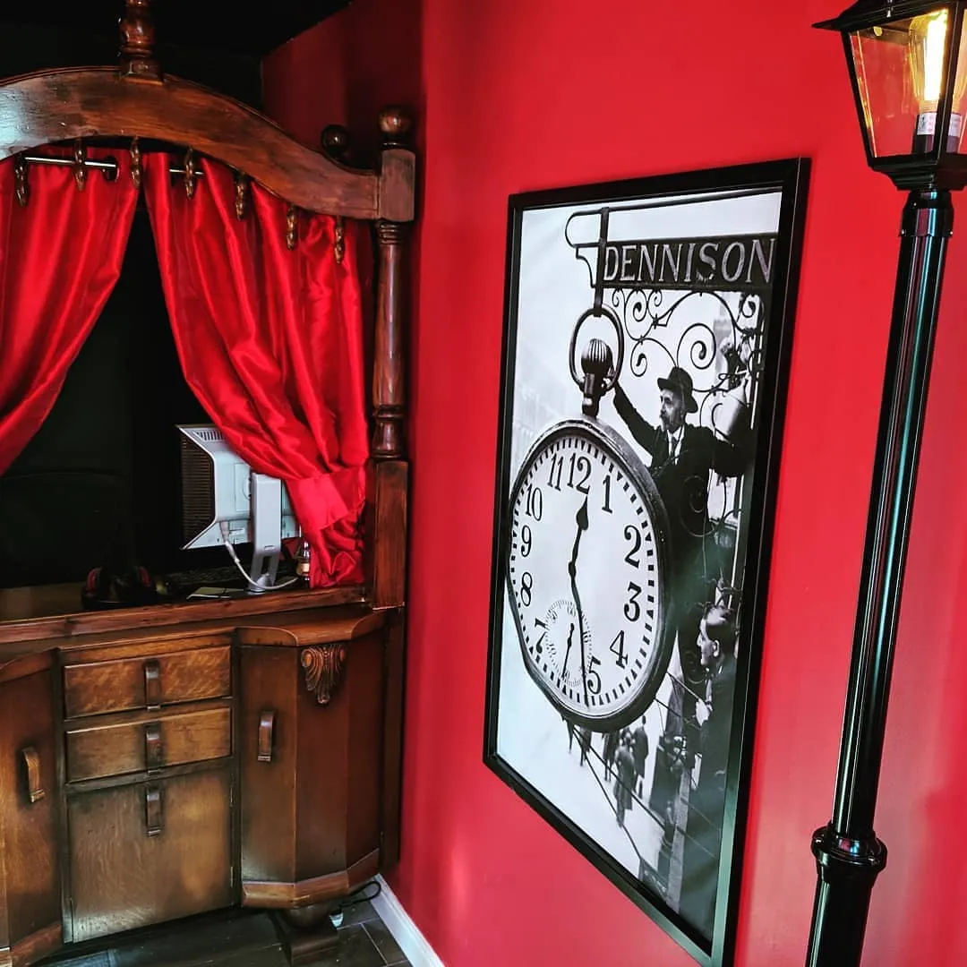 Vintage decor with clock poster and red curtains