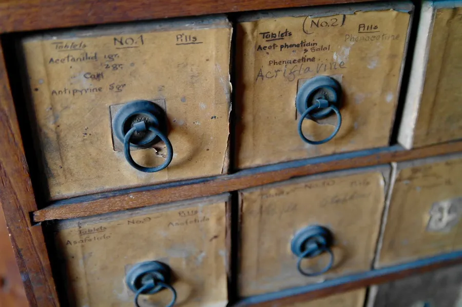 Vintage wooden drawers with handwritten labels