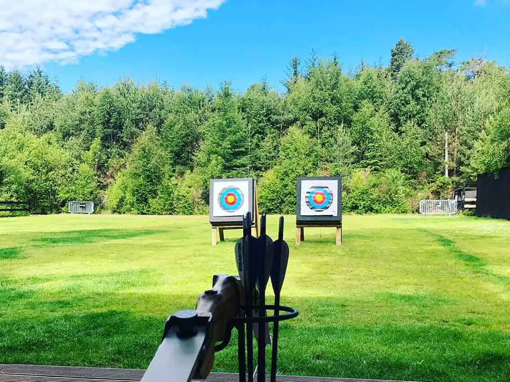Archery range with targets and bow.