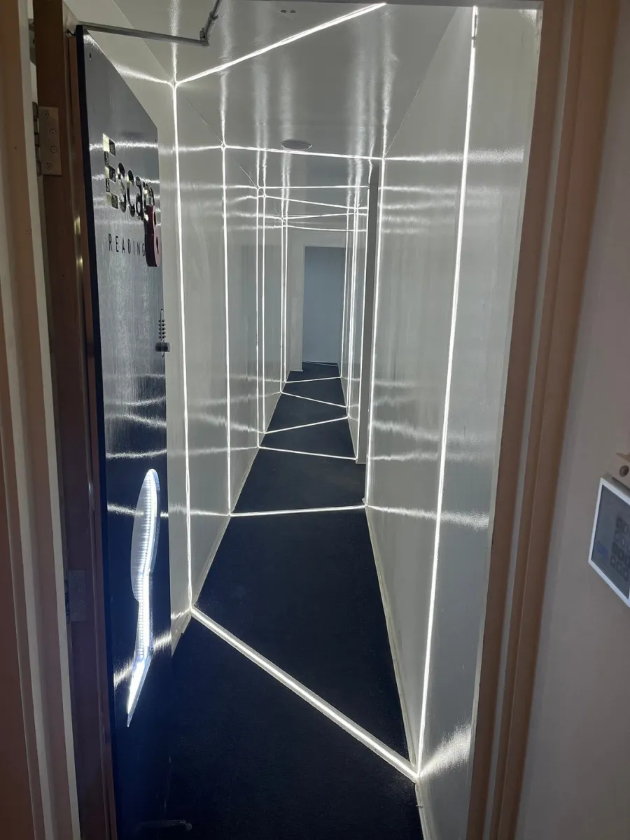 Illuminated hallway with geometric light patterns