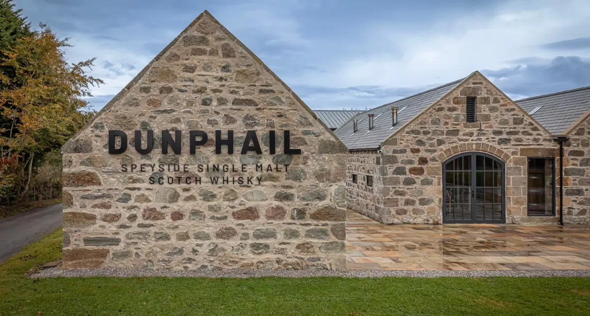 Stone building with Dunphail distillery sign