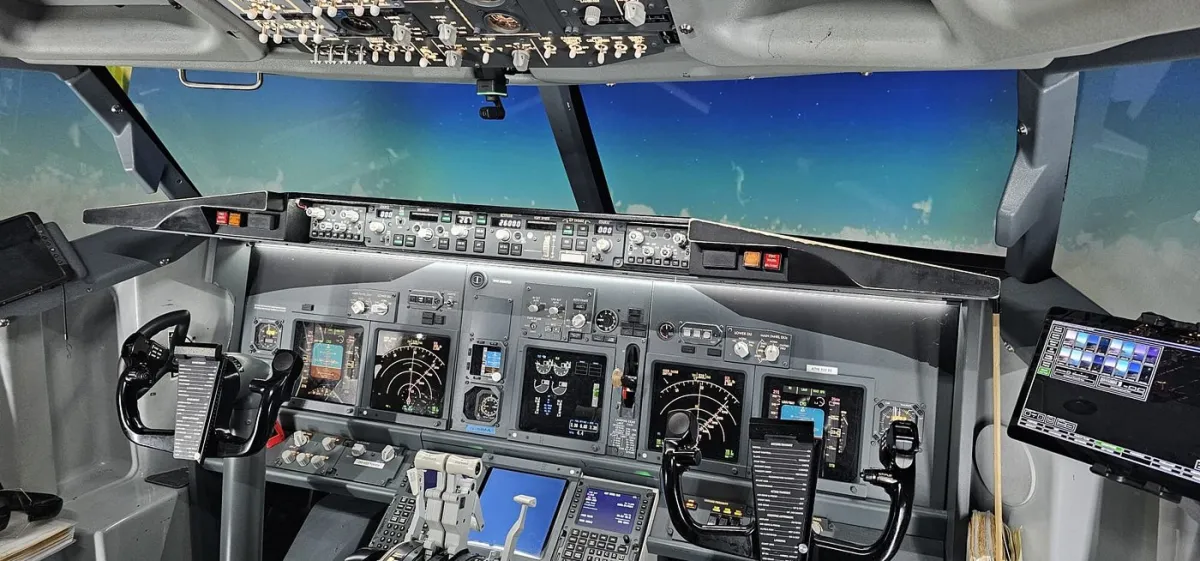 Airplane cockpit with control panels and screens