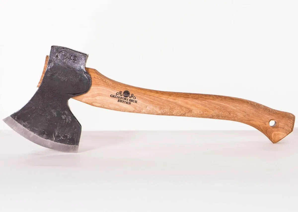 Wooden-handled axe with engraved logo