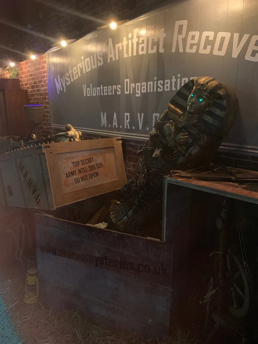 Sarcophagus in a wooden crate with M.A.R.V.O. sign.