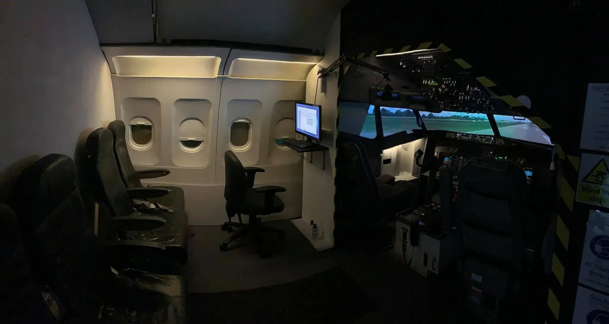 Interior of a flight simulator cockpit and passenger seats