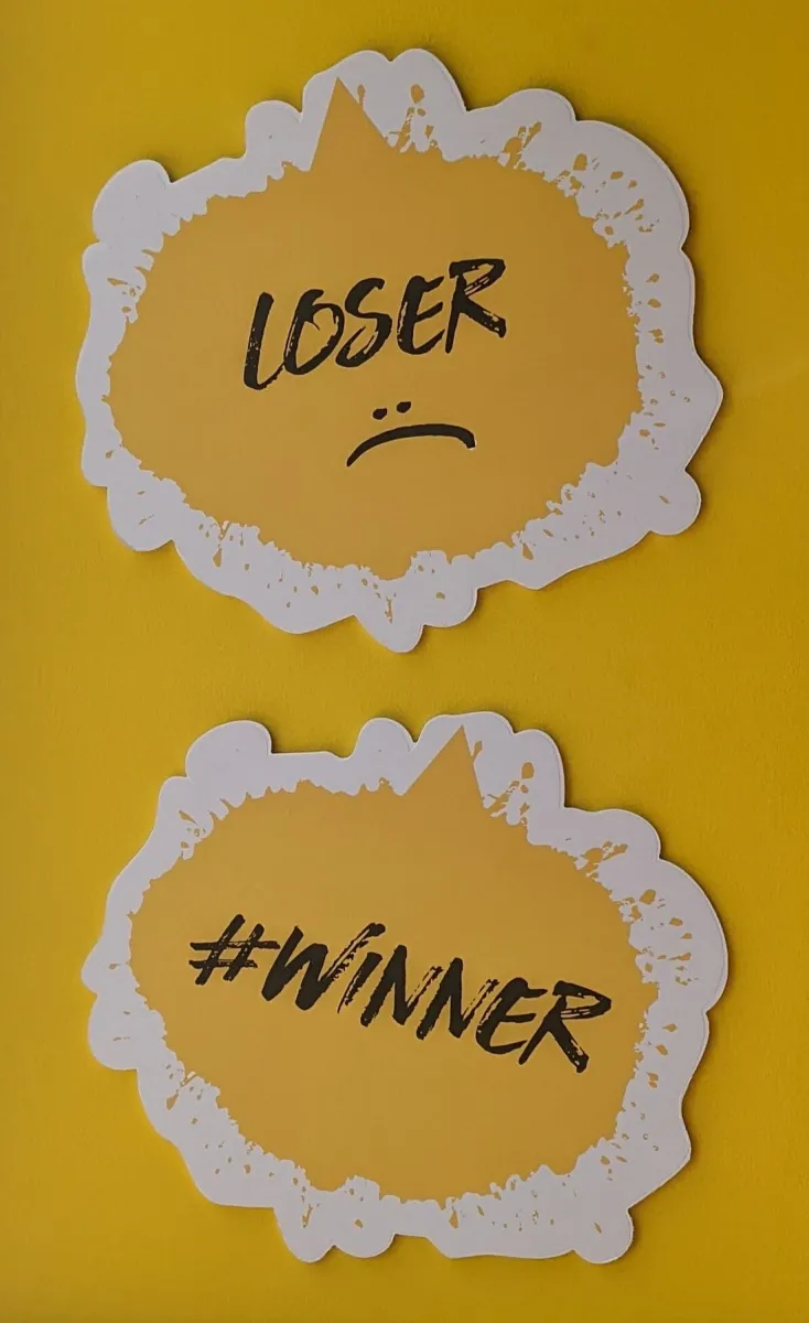 Two speech bubbles with 'Loser' and '#Winner' text