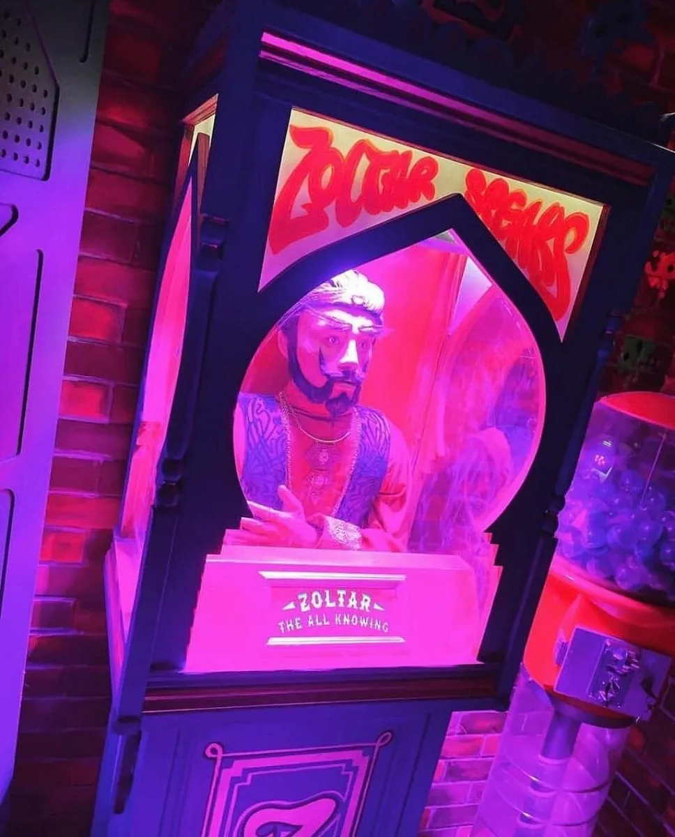 Zoltar fortune teller machine with neon lights