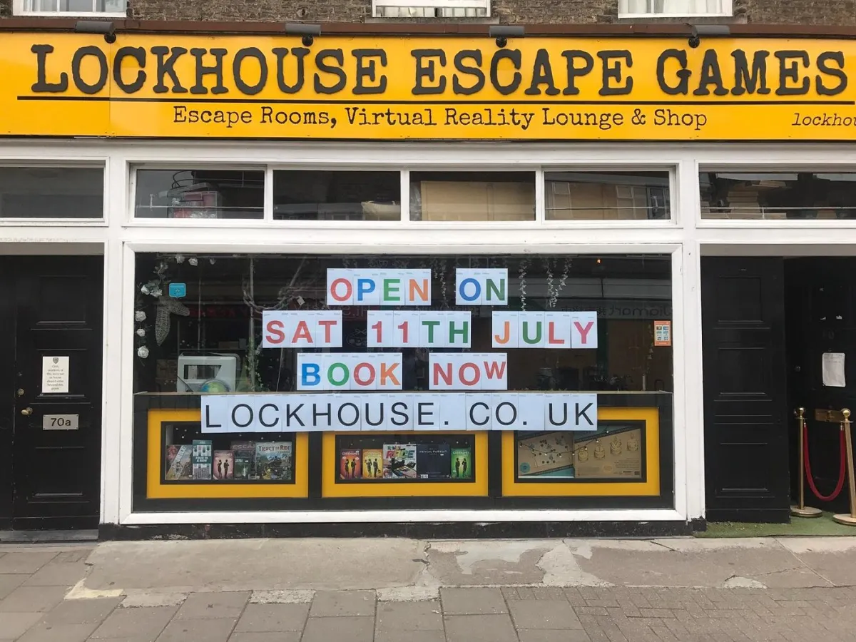 Storefront of Lockhouse Escape Games with opening sign.