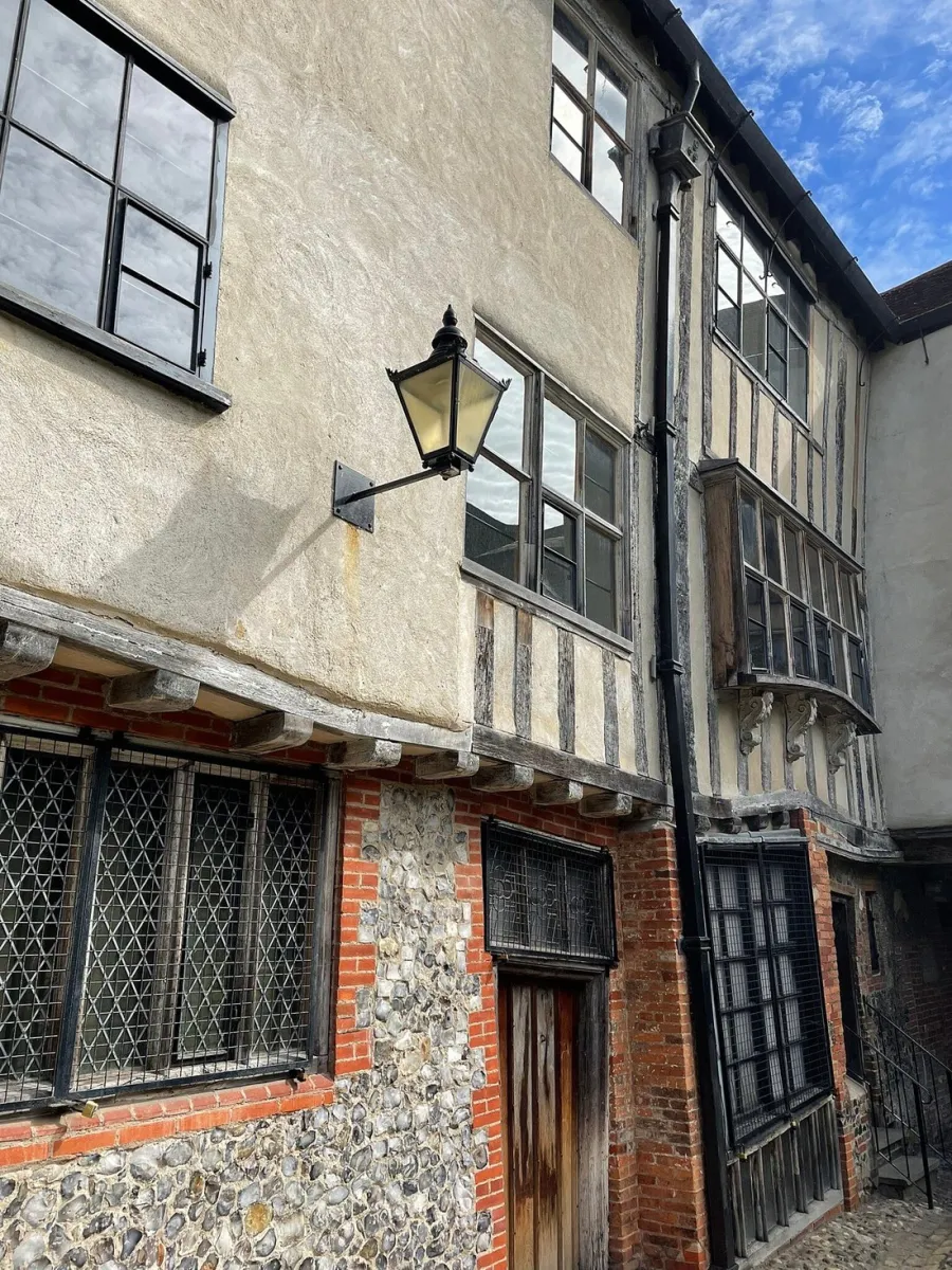 Old building with brick and flint facade.