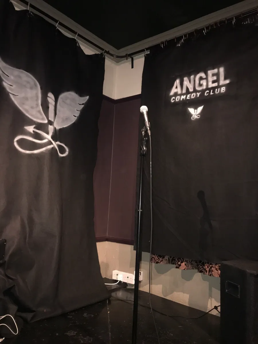 Empty stage with microphone at Angel Comedy Club