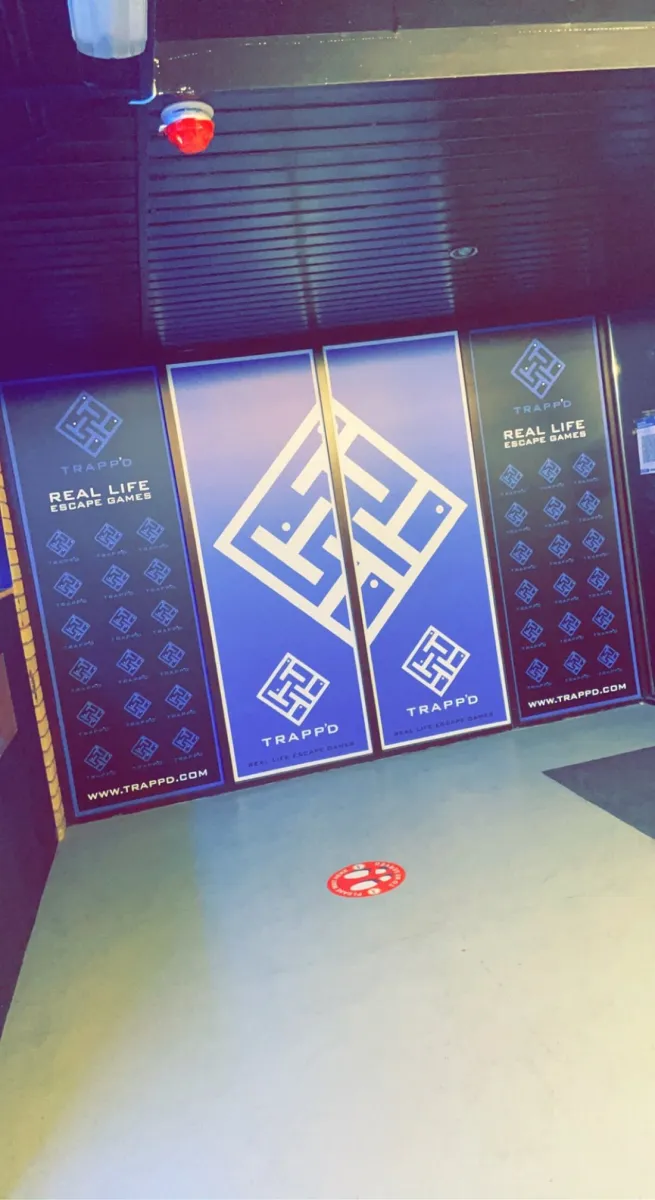 Entrance with Trapp'd escape games signage