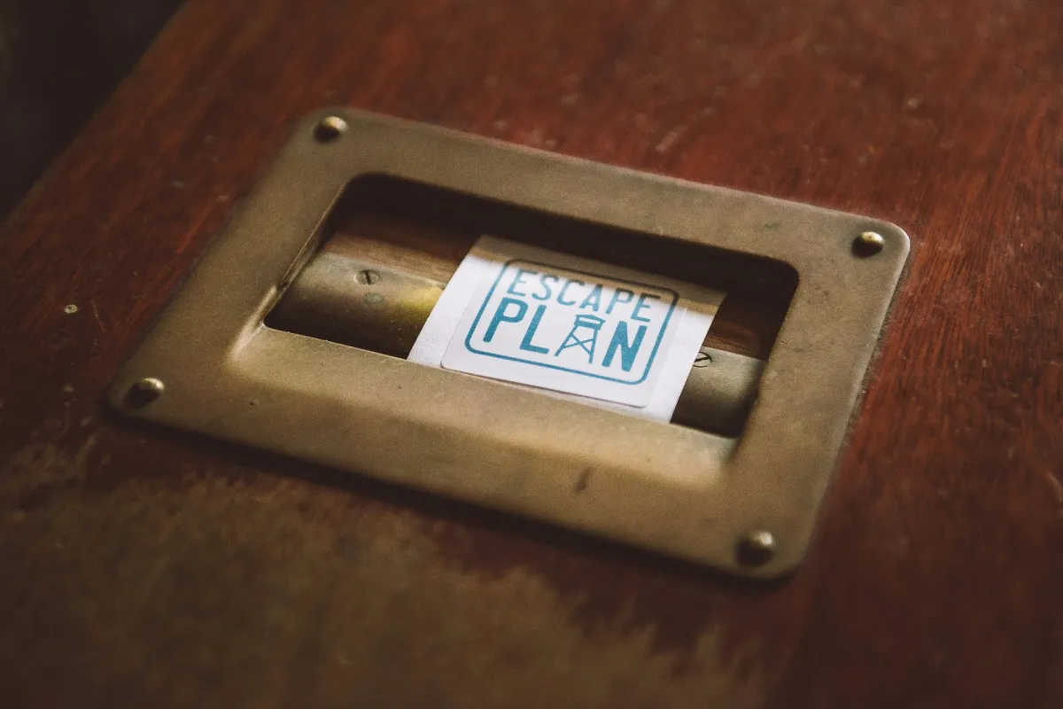 Metal handle with 'Escape Plan' label