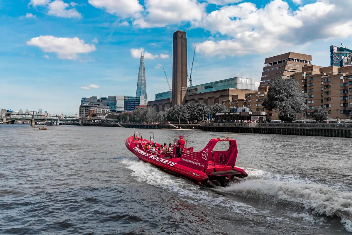 Red speedboat on the River Thames in London