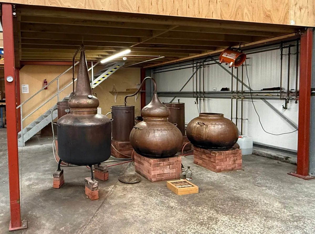 Copper distillation equipment in a workshop.