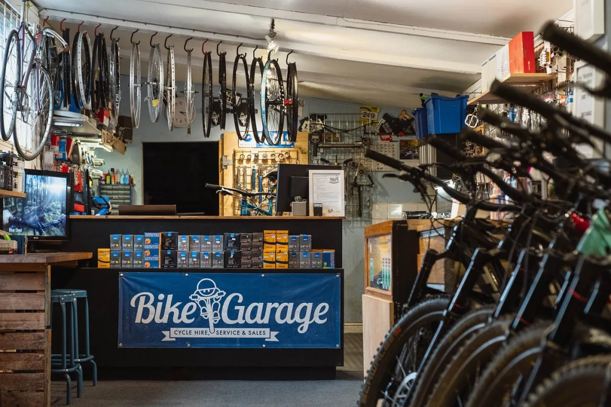Interior of a bike shop with bikes and accessories.