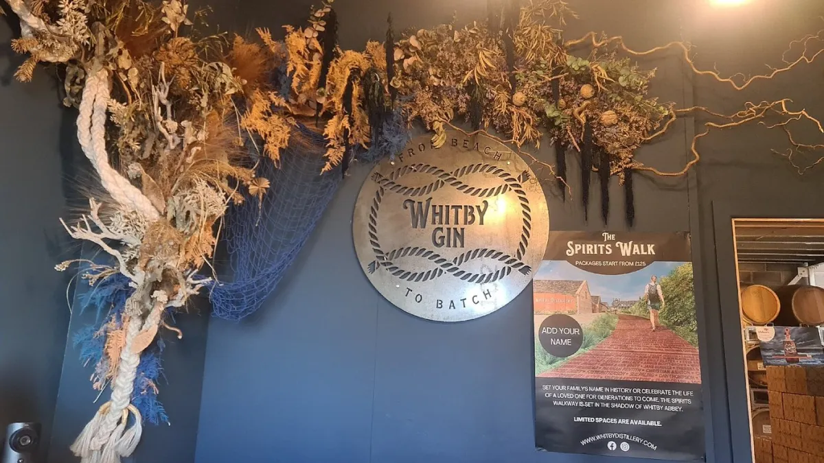 Whitby Gin sign with dried floral arrangement.