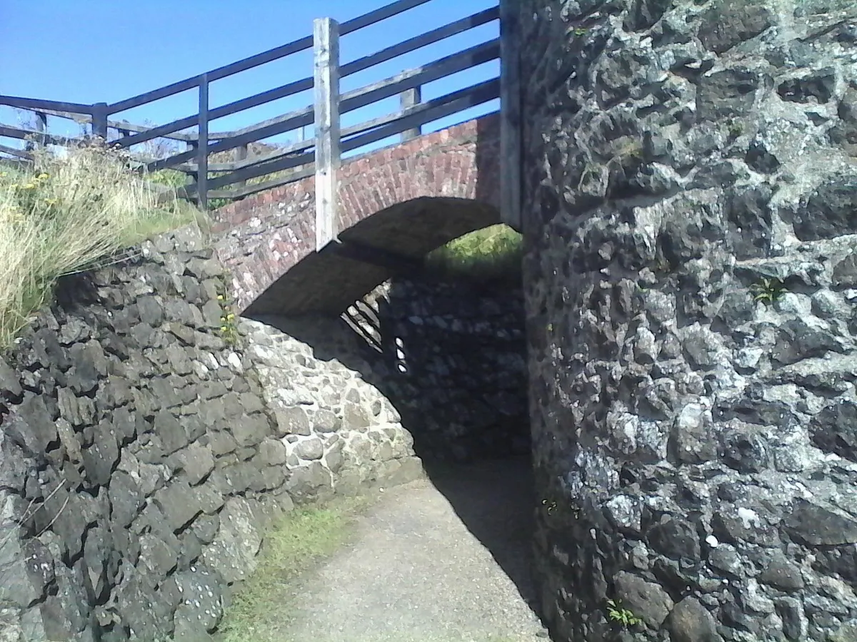 Stone bridge over a narrow path