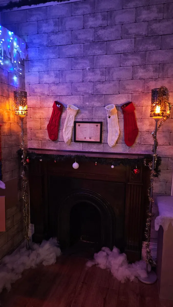 Fireplace with Christmas stockings and decorations