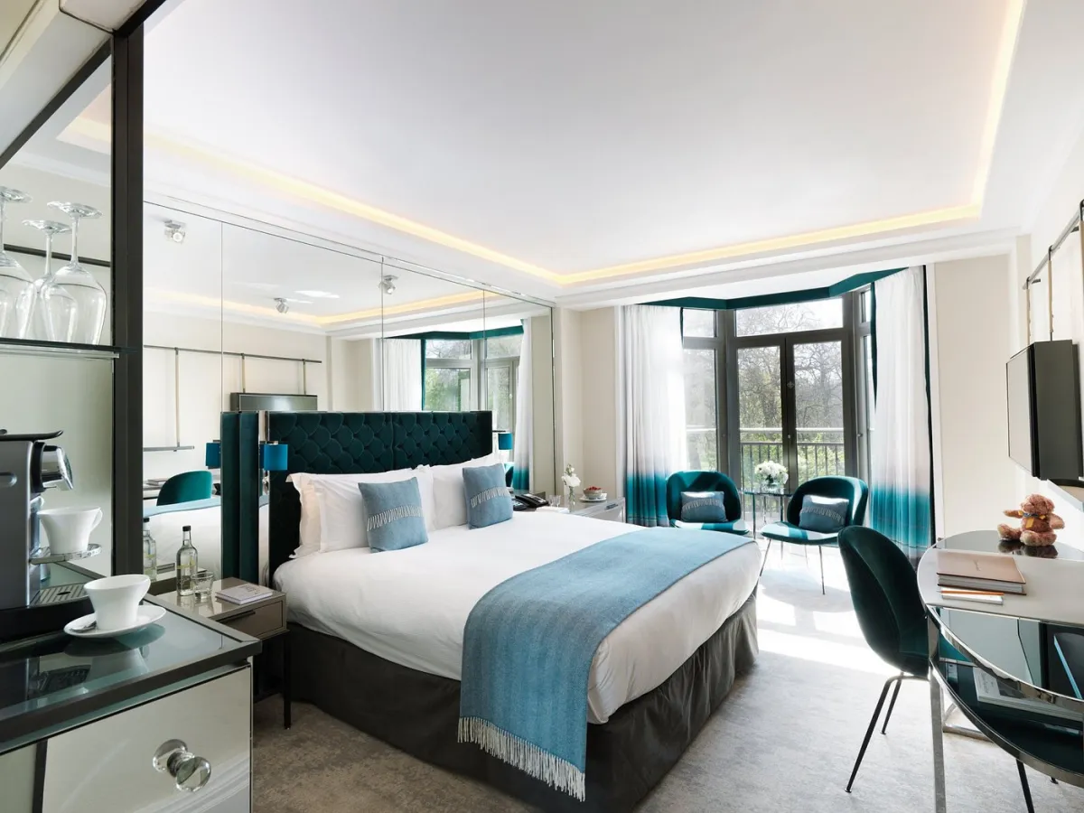 Modern hotel room with large bed and window view