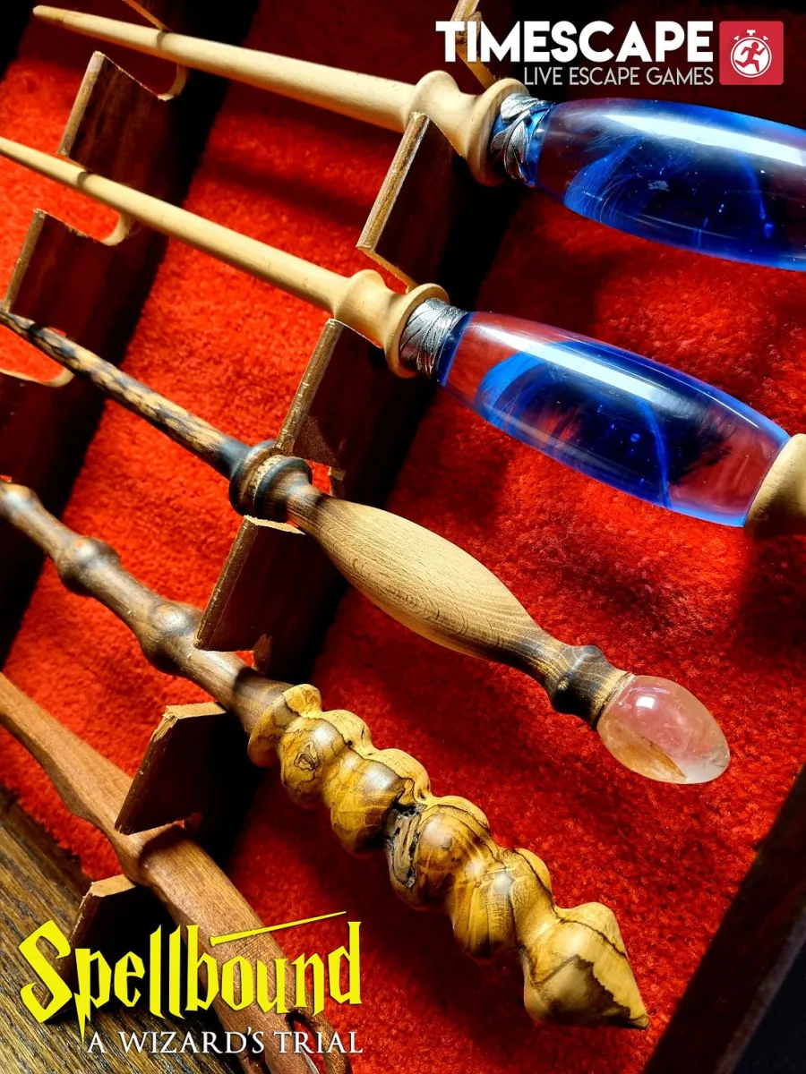 Wooden wands displayed on red fabric