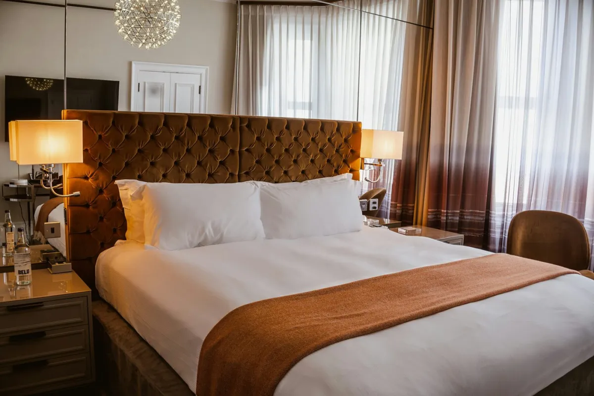 Hotel room with a large bed and elegant decor