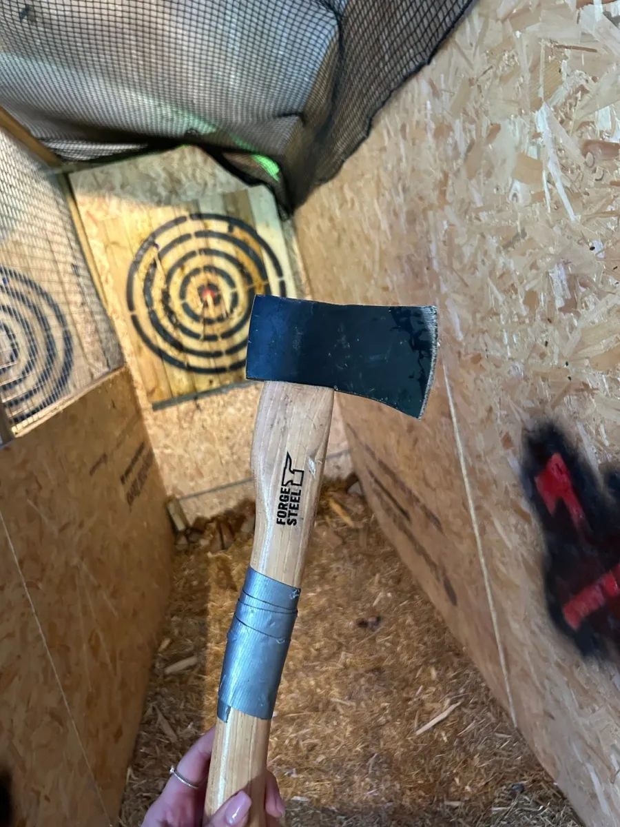 Axe in hand at an axe throwing range