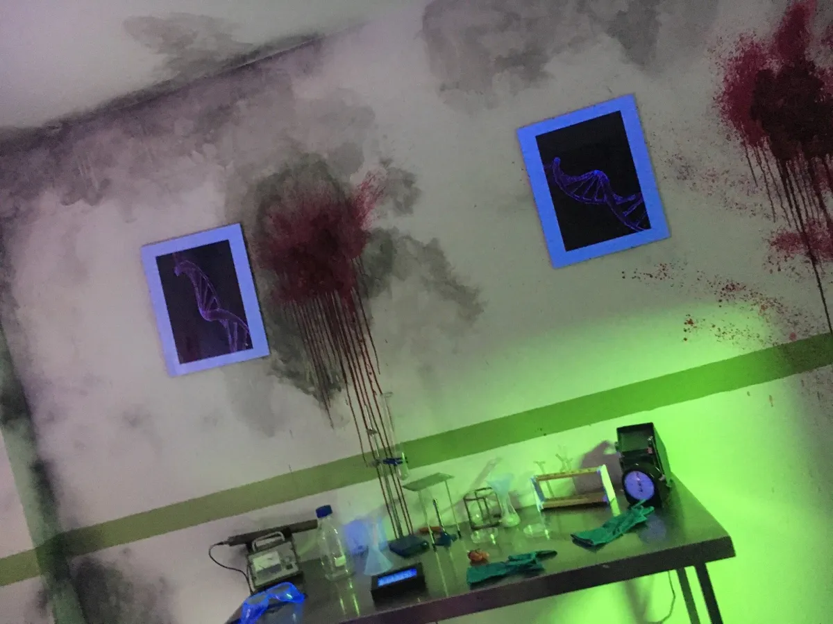 Dimly lit room with DNA art and lab equipment.