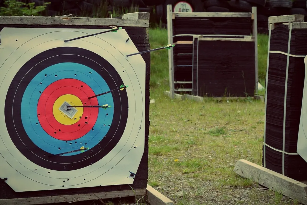 Archery target with arrows in bullseye