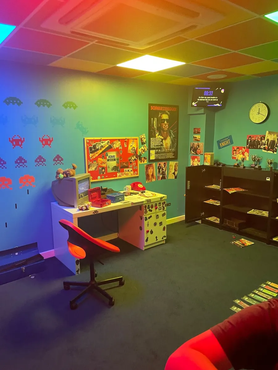Retro-themed room with desk, chair, and vintage decor.