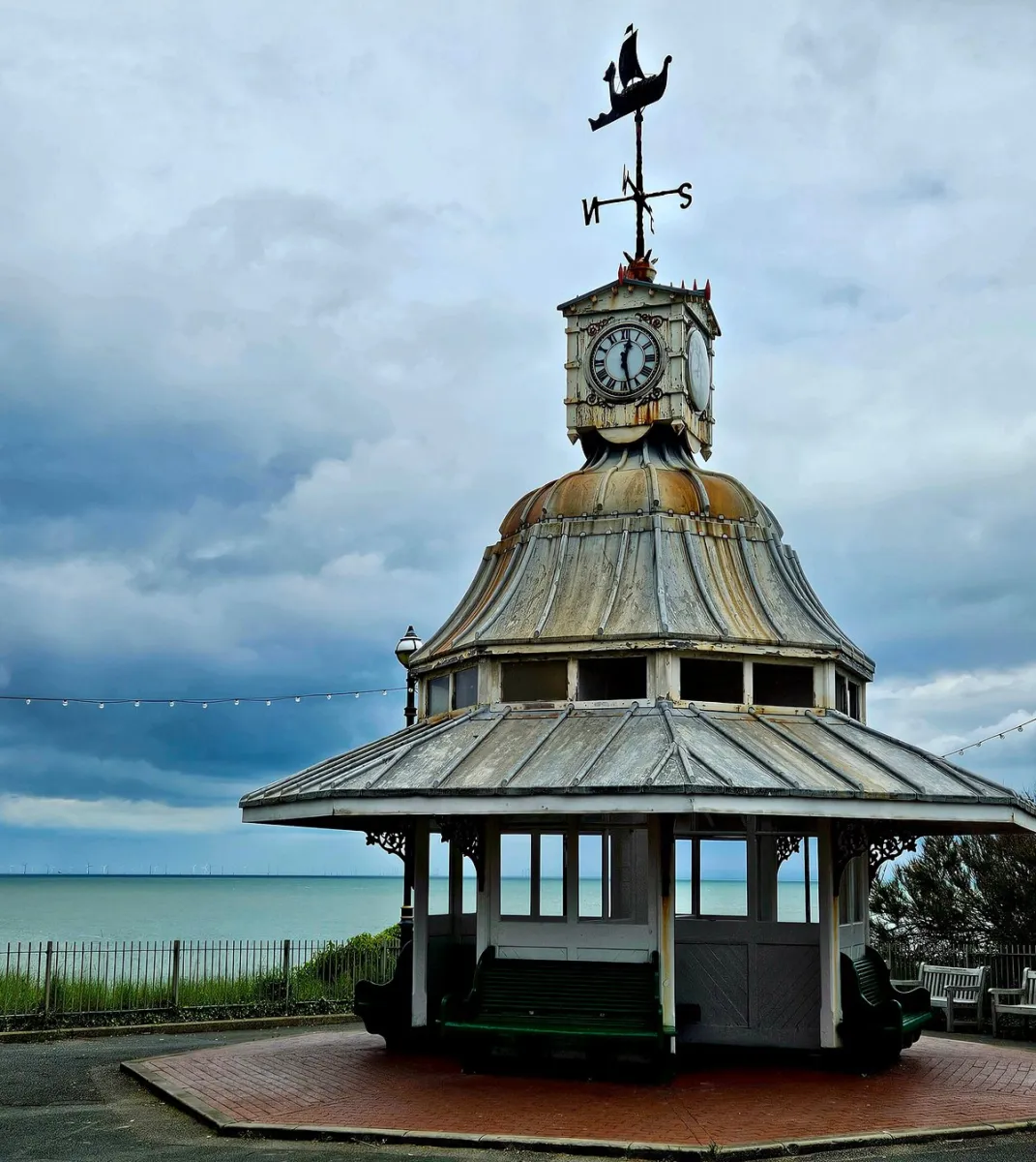 Seaside pavilion with clock and weather vane