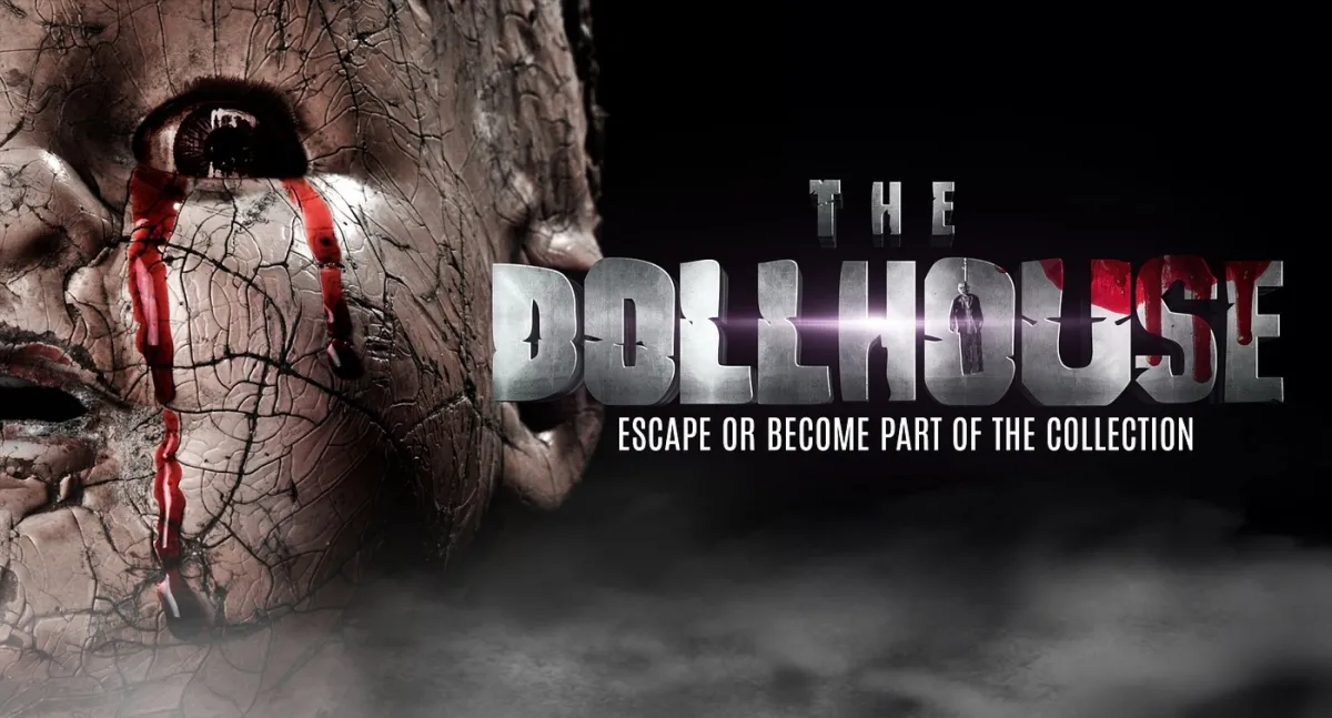 Creepy cracked doll face with red tears and text 'The Dollhouse'.