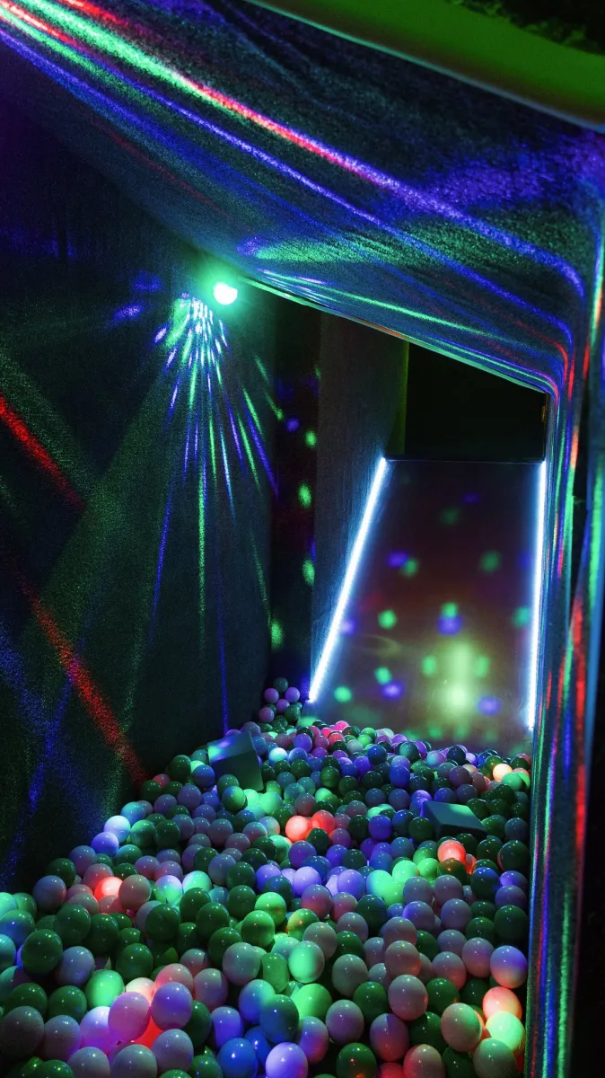 Colorful ball pit with disco lights