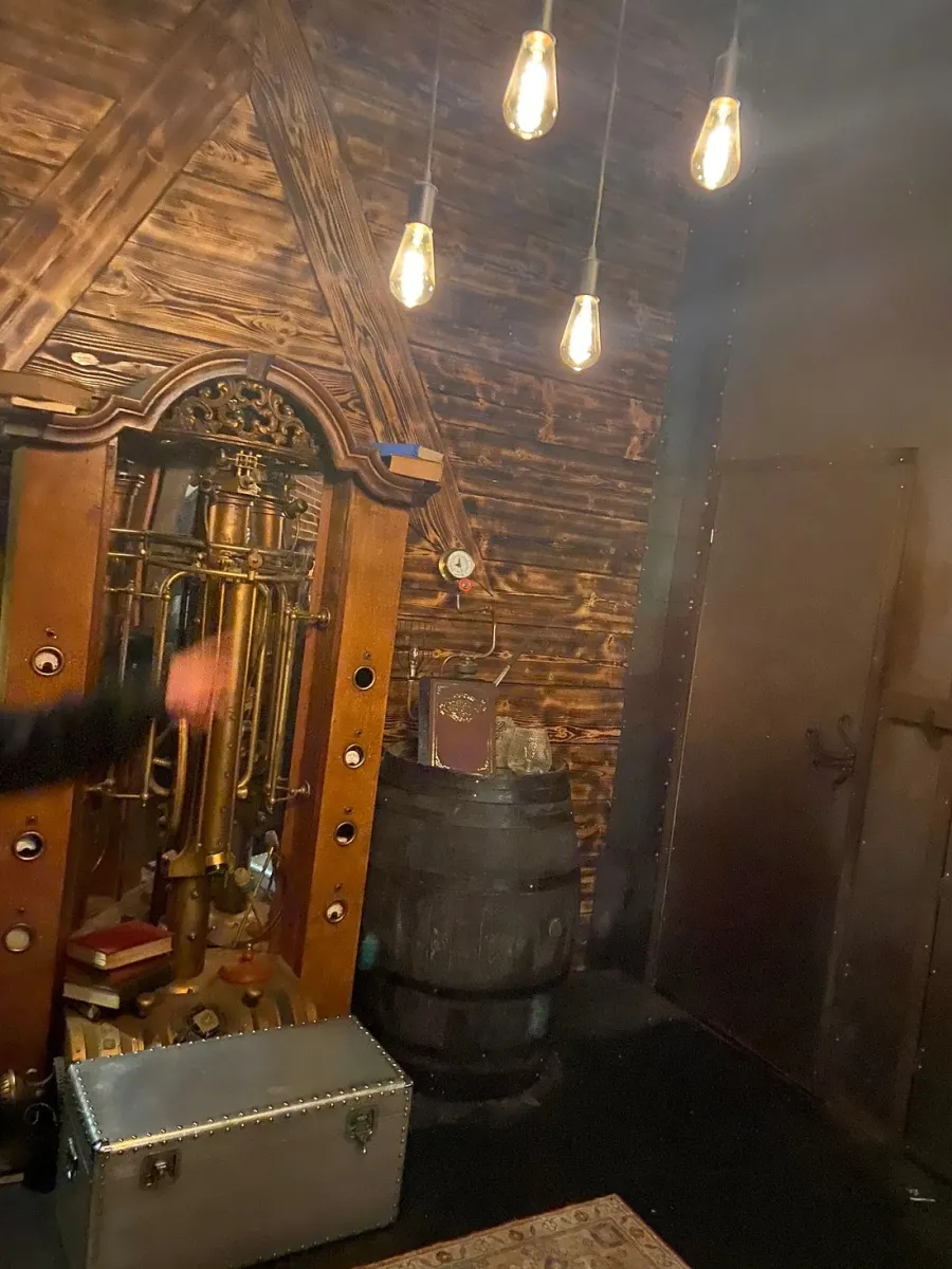 Vintage room with steampunk decor and hanging lights.