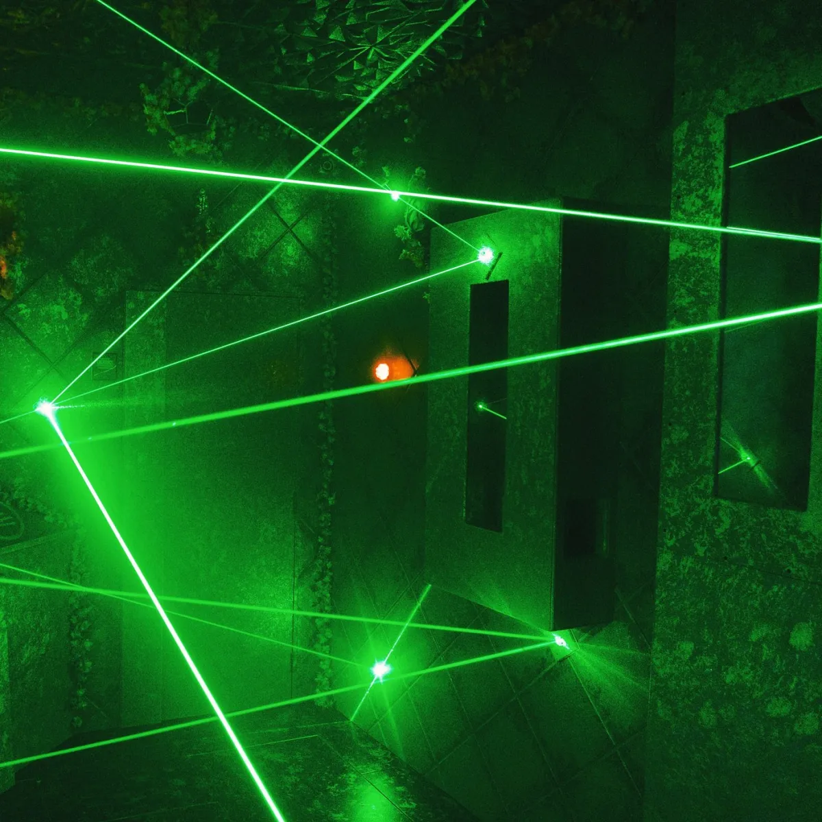 Room with intersecting green laser beams