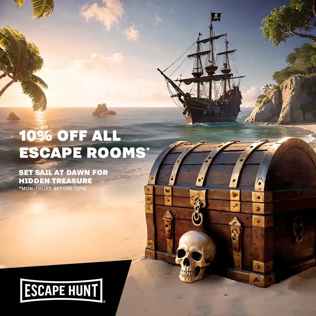 Pirate ship and treasure chest on a beach.