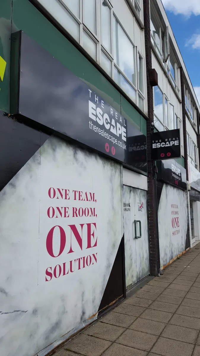 Exterior of The Real Escape building with signage.